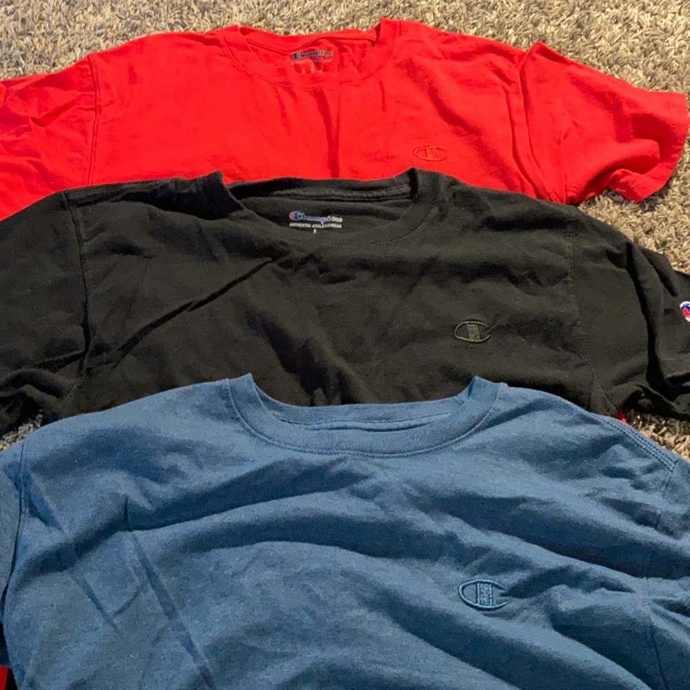 red , navy , and black small champion shirts